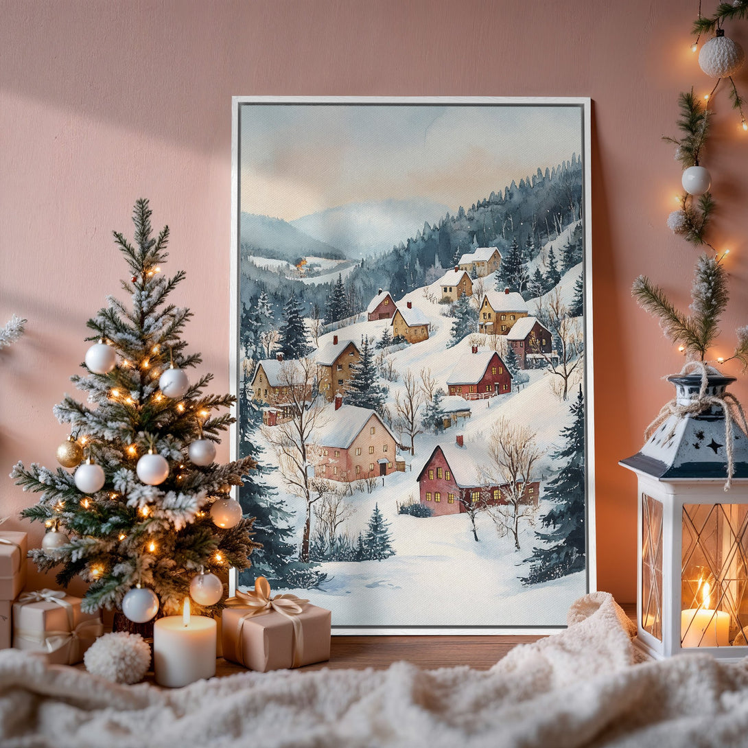 Framed Wall Art: Watercolor winter village scene in soft blues, greens, and warm reds. Cozy holiday decor for your home.