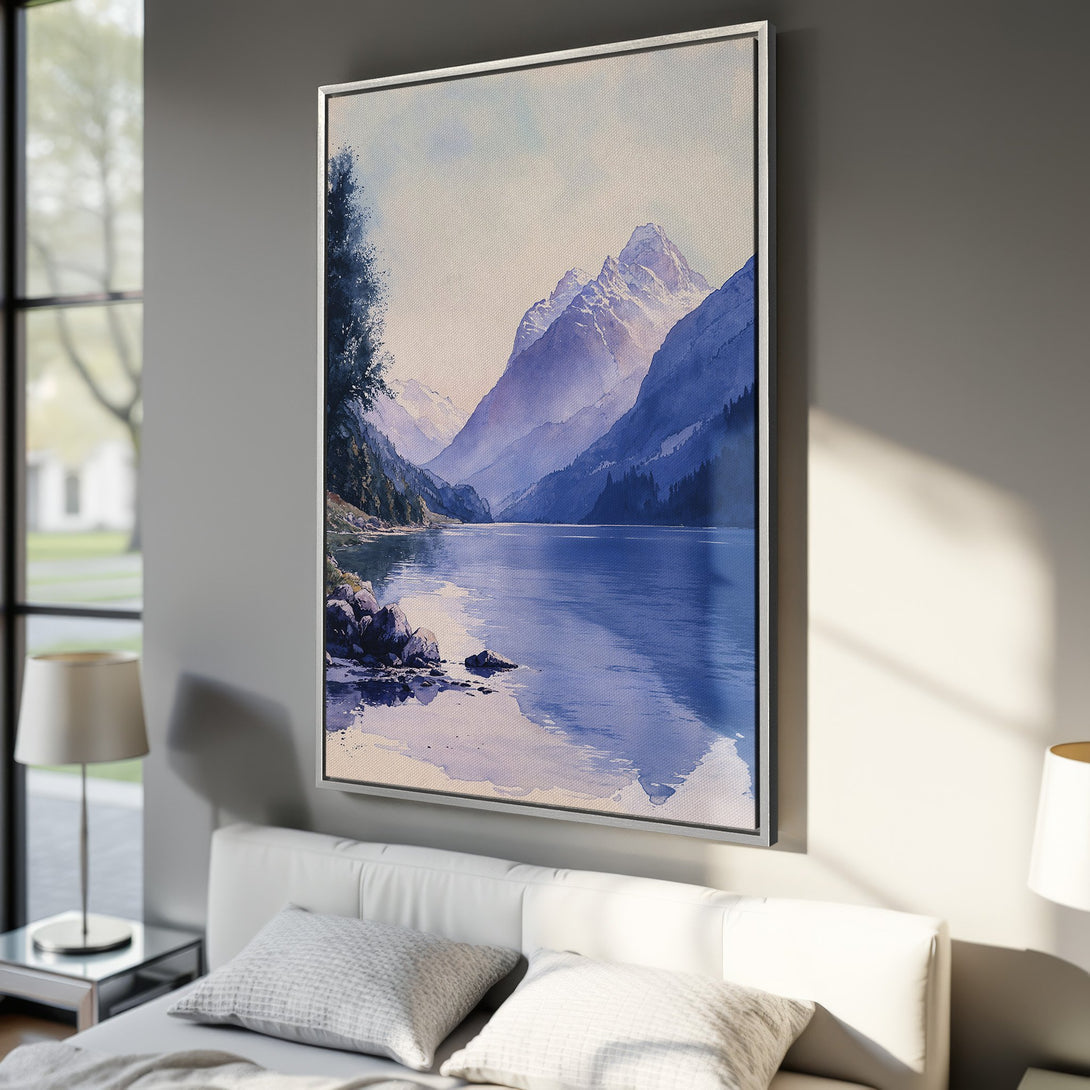 Framed Wall Art: Serene watercolor landscape Canvas Print featuring mountains and lake in a cool blue and purple palette. Perfect for calming bedroom decor.