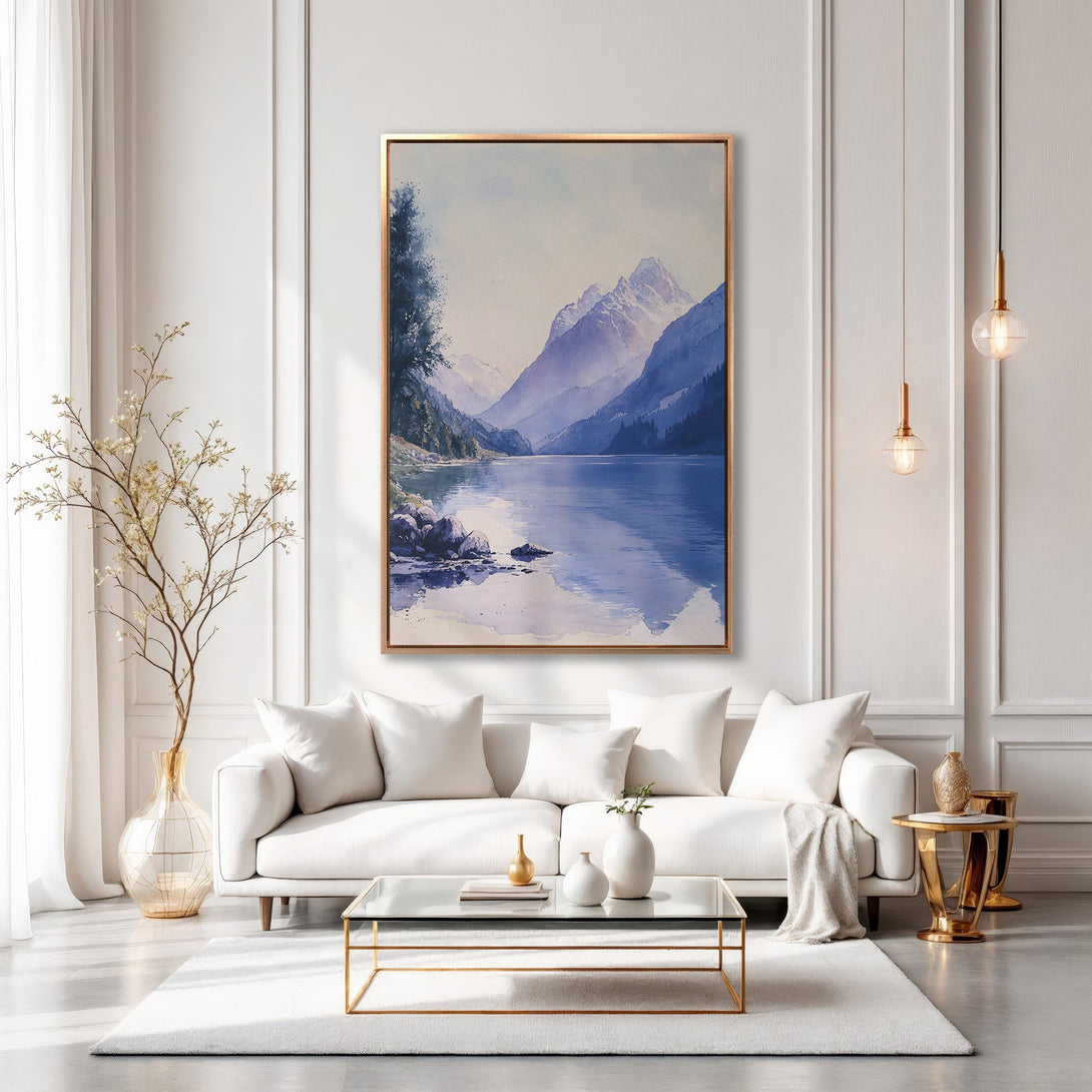 Framed Wall Art: Watercolor landscape Canvas Print in a modern living room. Featuring blue and purple mountains, serene lake, and gold frame. Elevate your space!