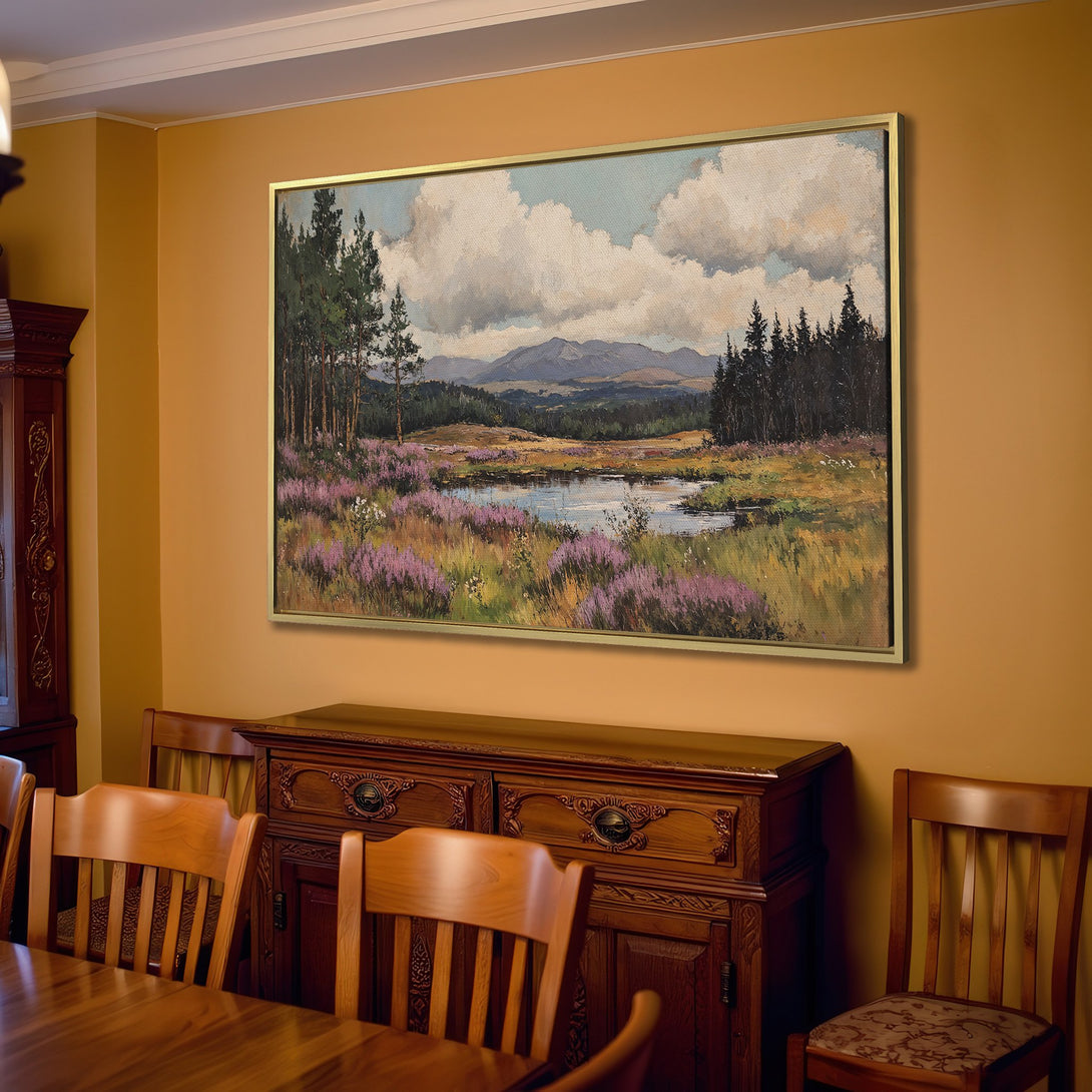 Canvas Print of a landscape painting with a serene lake, featuring blues, greens, and purples, displayed in a cozy living room.