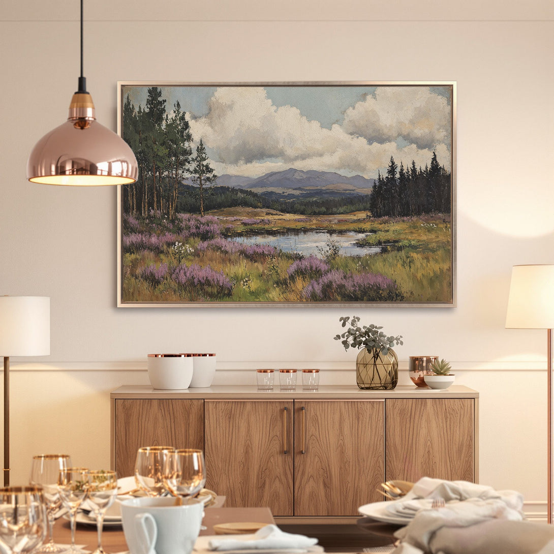 Framed Wall Art: Landscape painting with a serene lake scene, featuring purple wildflowers and lush greenery. Earthy tones create a calming aesthetic.