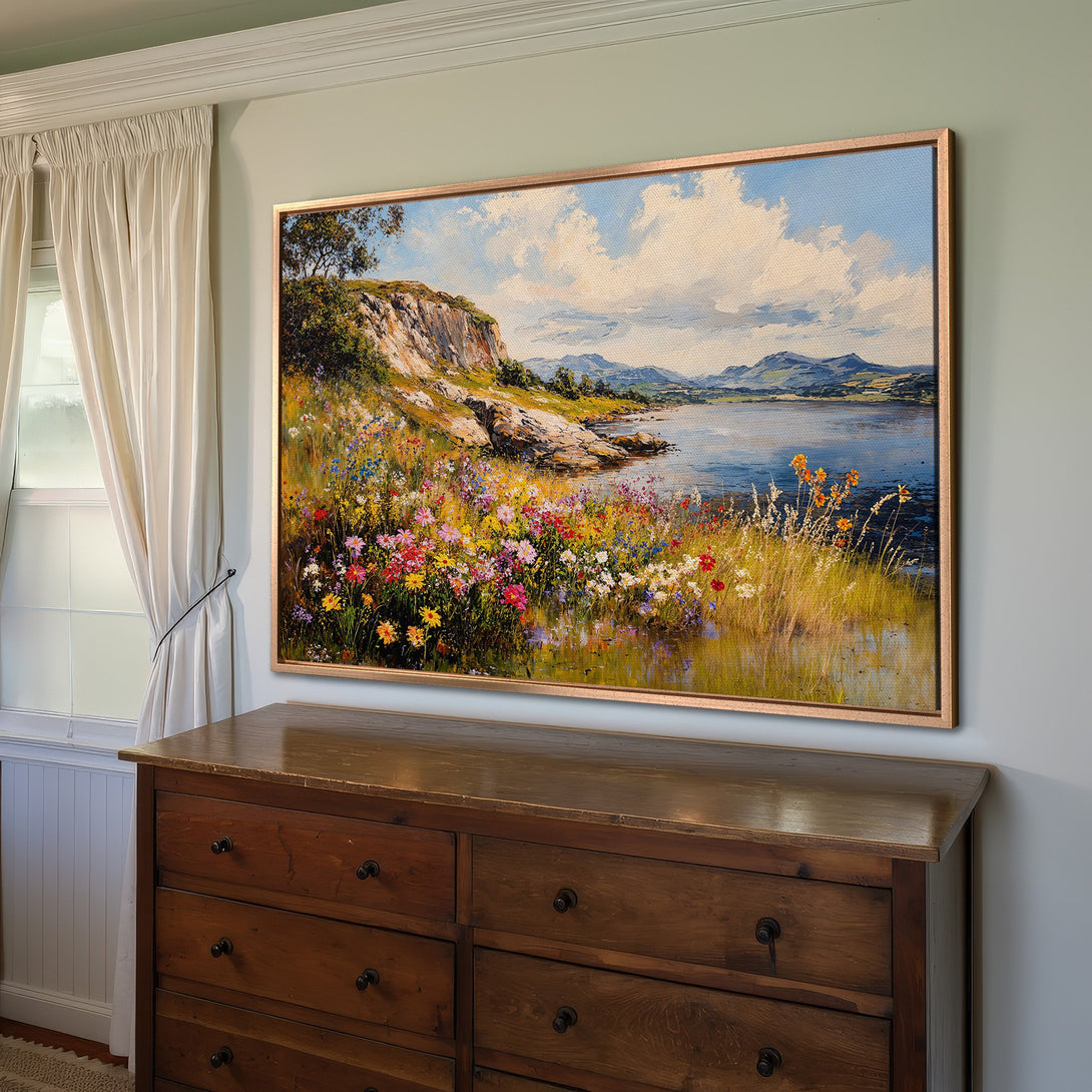 Framed Wall Art featuring a vibrant landscape painting with a colorful floral foreground, blue water, and sky. Adds a touch of nature's beauty to any interior.