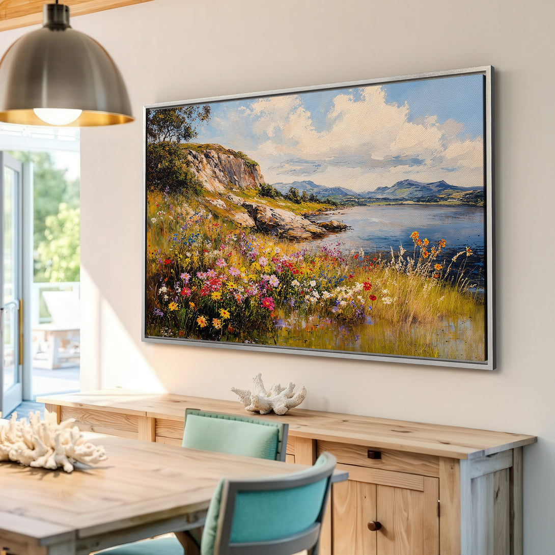 Framed Wall Art: Landscape painting with a vibrant floral meadow, lake, and mountains. Impressionistic style, showcasing a colorful, natural palette.