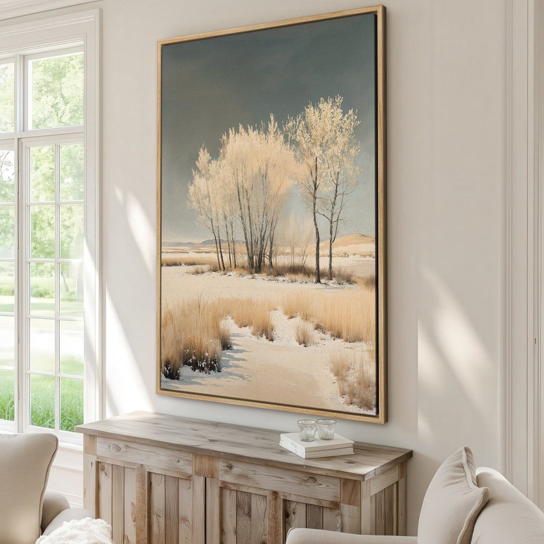 Framed Wall Art featuring a serene winter landscape with trees and snow, in a neutral color palette. Bring the beauty of nature indoors with this Canvas Print.