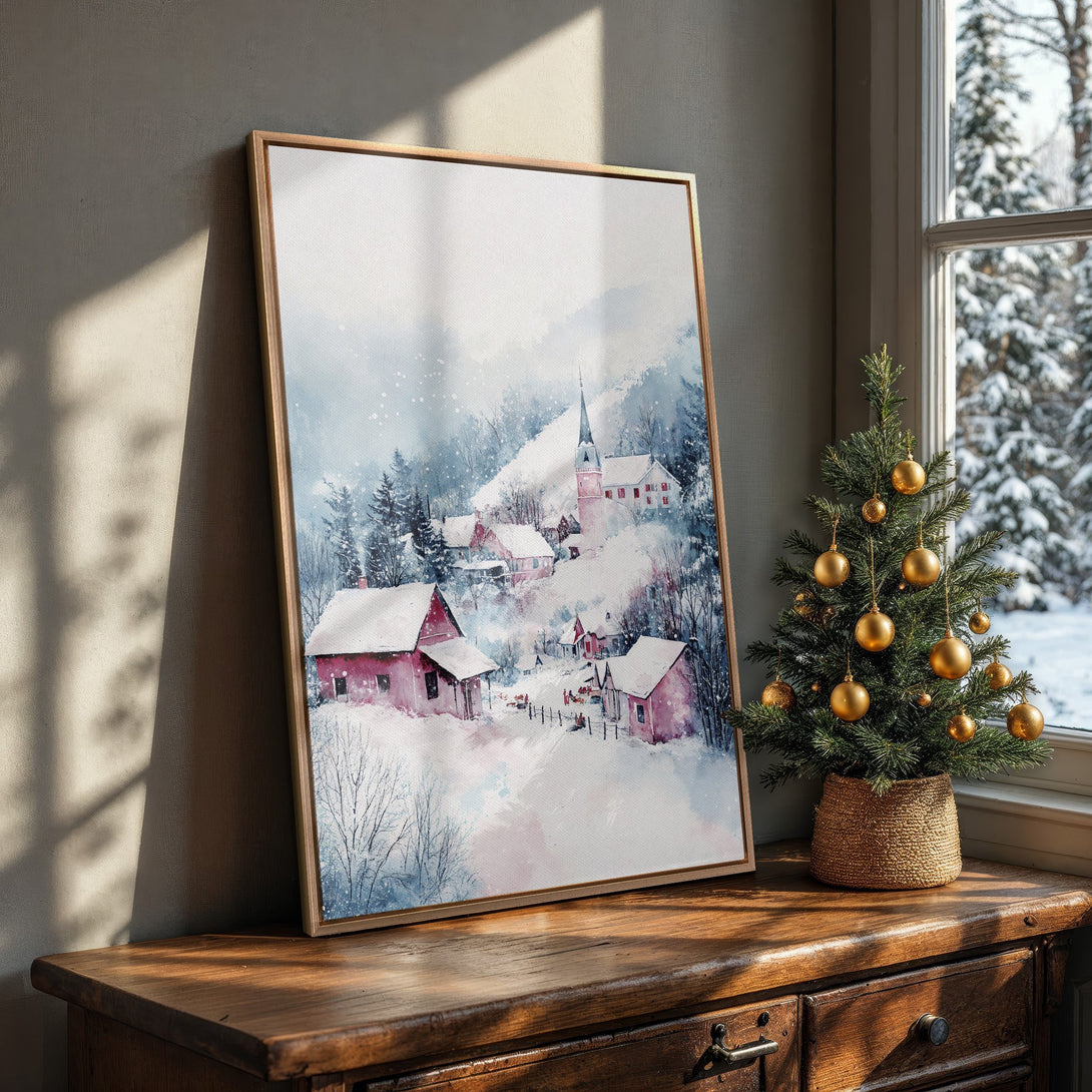 Framed Wall Art: Watercolor winter village scene with red houses and snowy landscape. Blue and pink color palette, perfect for cozy home decor.