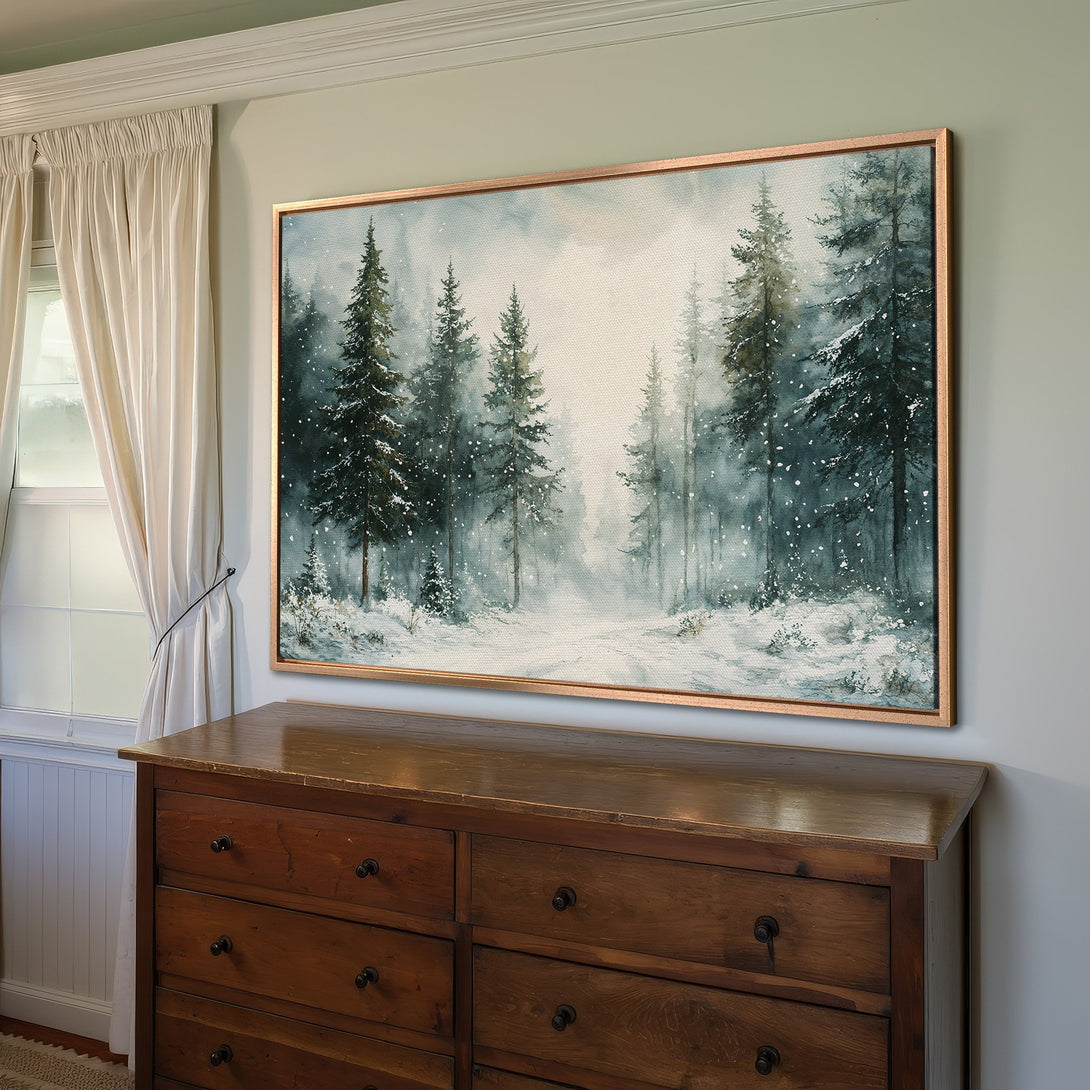 Framed Wall Art of a snowy forest scene in watercolor style. Featuring a cool blue and green color palette, perfect for adding a touch of nature.