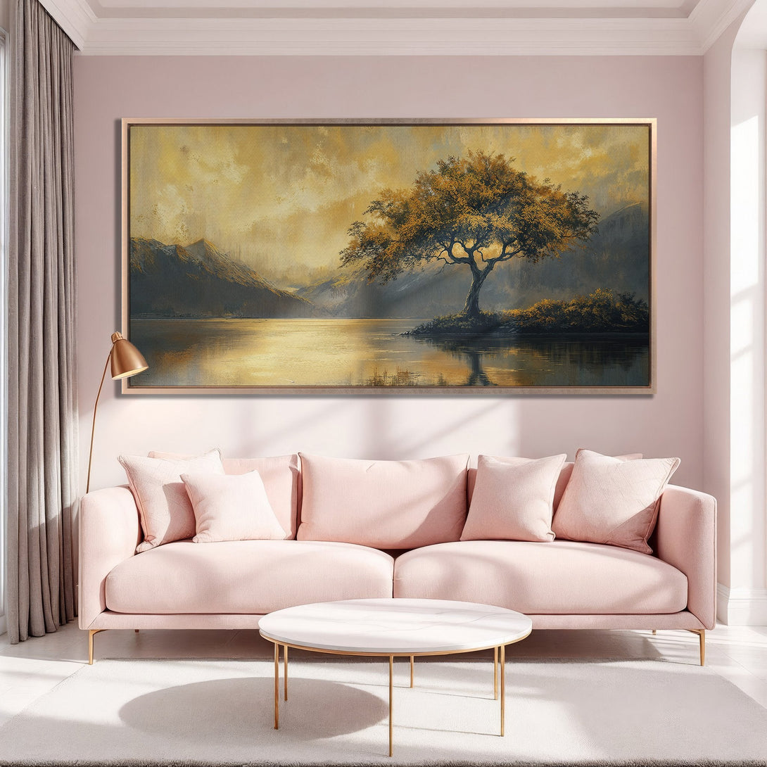 Framed Wall Art: Landscape Canvas Print with a golden tree over a lake. Warm, inviting color palette with gold, yellow, and pink hues.