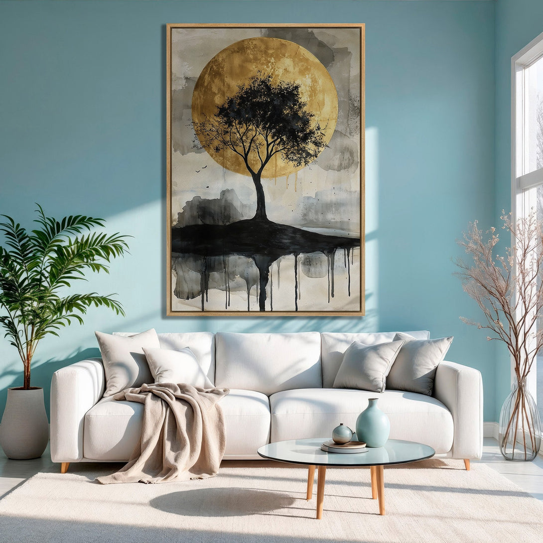 Framed Wall Art featuring an abstract tree against a golden moon. Modern style with a neutral and blue color palette, perfect for living room decor.