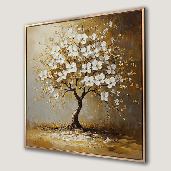 Framed Wall Art: Elegant tree art print with white blossoms and a warm, gold and brown color palette. Perfect for adding a touch of nature to your decor.