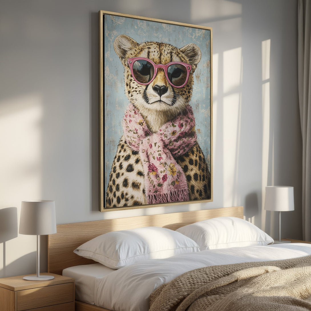 Framed Wall Art: Chic cheetah portrait in pink sunglasses & scarf. Stylish wall decor with a soft blue & pink color palette, perfect for bedroom or living room.