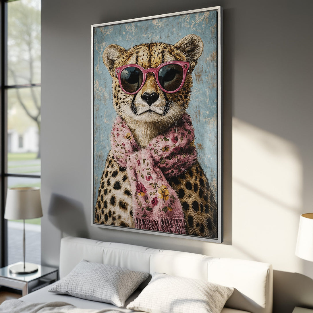 Framed Wall Art: Stylish cheetah portrait with pink sunglasses and scarf. Blue, pink, and brown color palette. Perfect for adding a touch of fun to your decor!