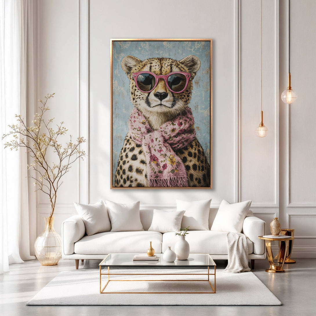 Framed Wall Art: Hipster cheetah wearing sunglasses & scarf, displayed in a stylish interior. Features a blue, pink & gold color palette for a chic home decor statement.