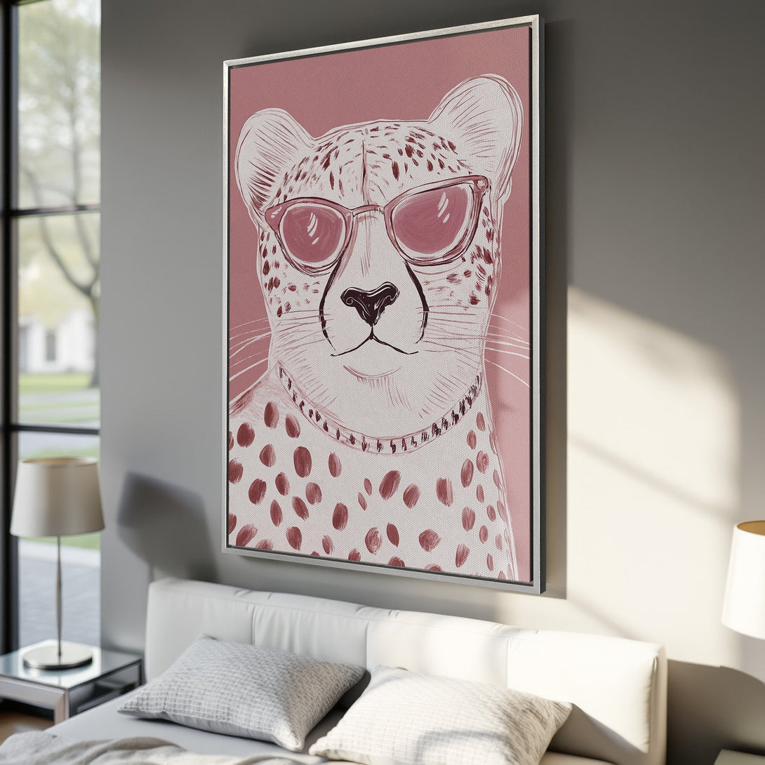 Framed Wall Art featuring a cool cheetah with sunglasses. Modern, minimalist style in a pink and neutral color palette. Perfect for adding a touch of fun!