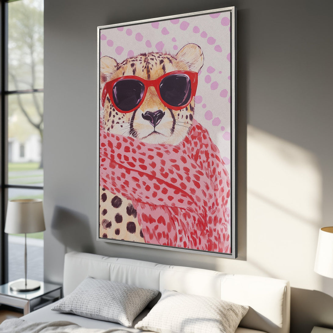 Framed Wall Art featuring a cool cheetah wearing sunglasses and a scarf. Modern, colorful art with a pink and red palette. Perfect for a stylish home.