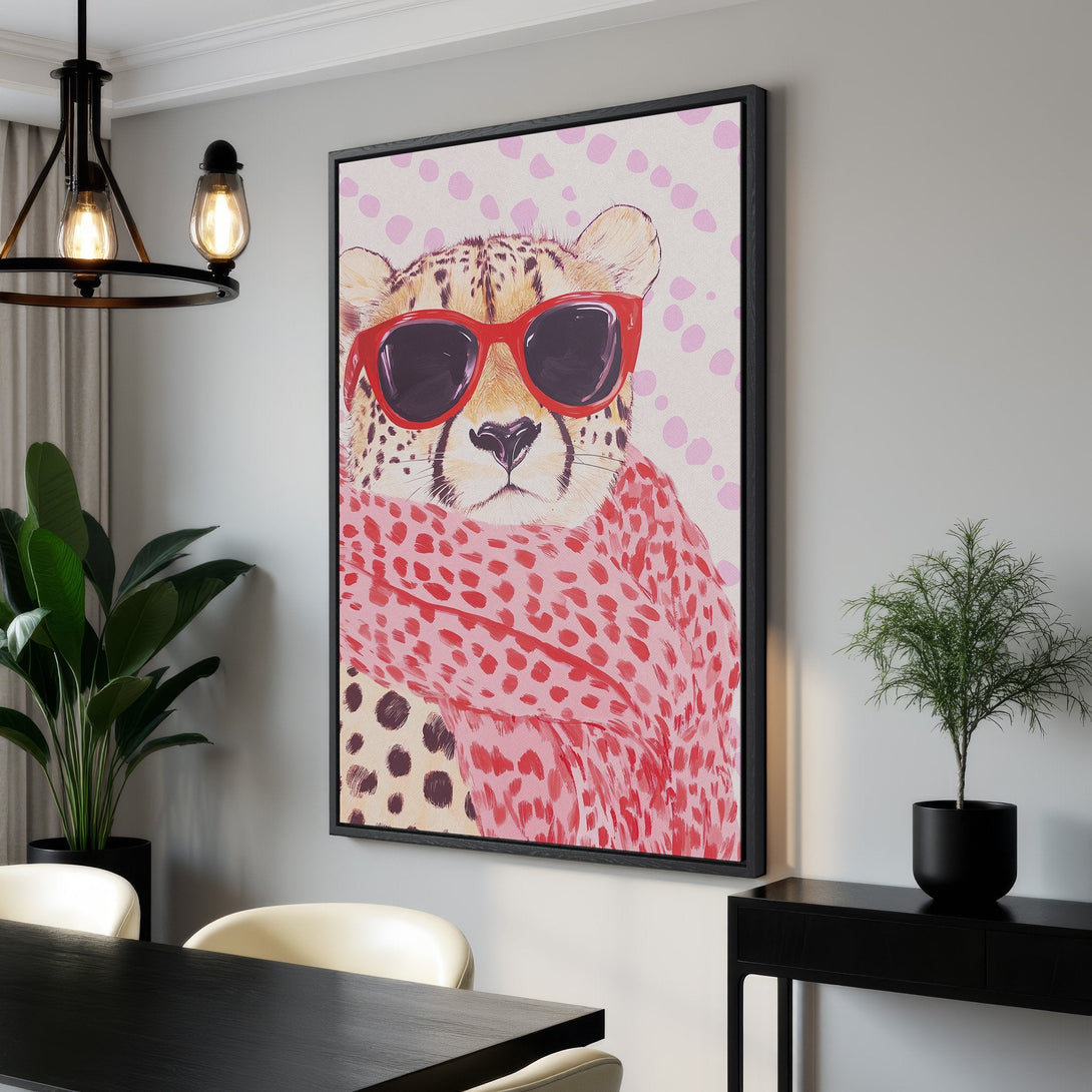 Framed Wall Art featuring a stylish cheetah wearing sunglasses and a scarf. Pop art style with a pink and red color palette, perfect for modern decor.
