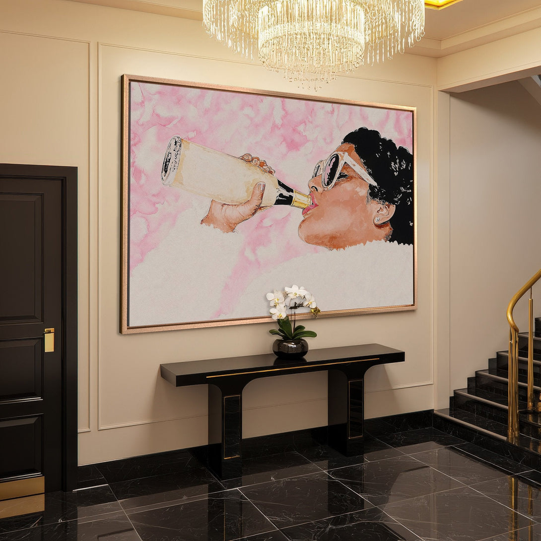 Framed Wall Art featuring a woman drinking champagne in a pop art style, with a pink and neutral color palette. Elevate your space!