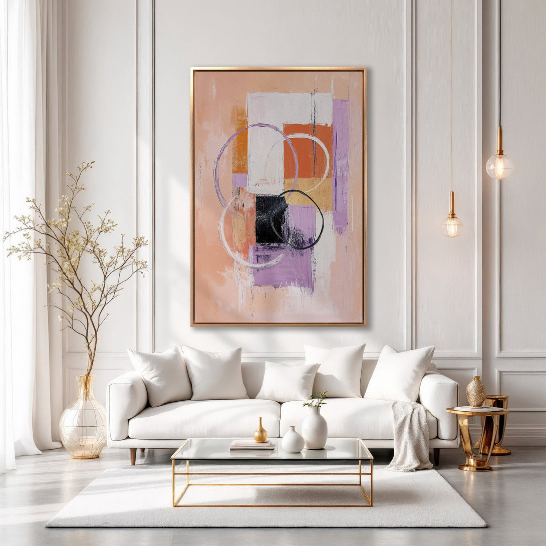 Framed Wall Art: Abstract art canvas print in a modern living room. Features a warm color palette of peach, orange, and purple. Elevate your space with stylish wall decor.