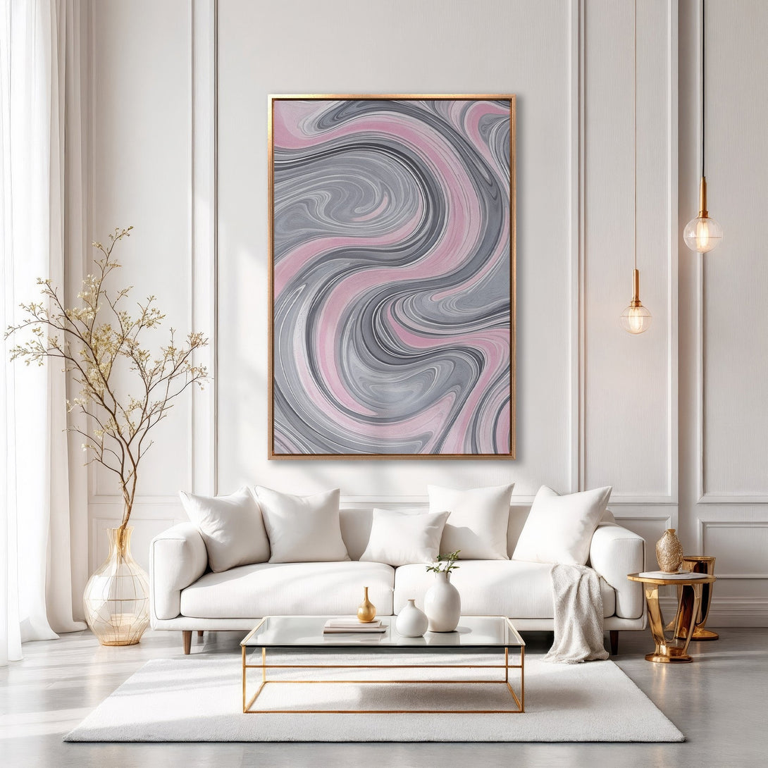 Framed Wall Art: Abstract swirl design in pink and gray, displayed in a modern living room. Elevate your space with this stylish canvas print.