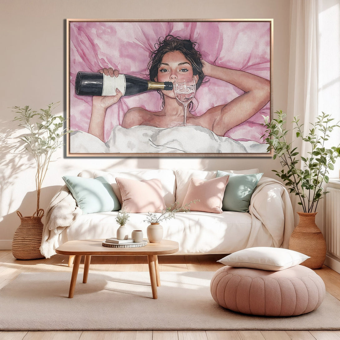 Framed Wall Art of woman with champagne in bed, watercolor style. Soft pink and neutral tones create a relaxing vibe. Perfect for bedroom decor.