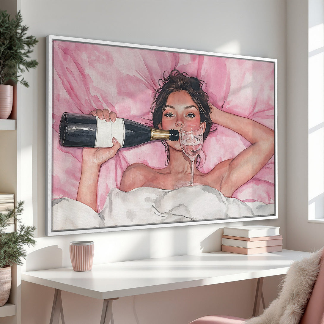 Framed Wall Art: Watercolor painting of a woman with champagne. Soft pink tones create a relaxing and stylish interior aesthetic.