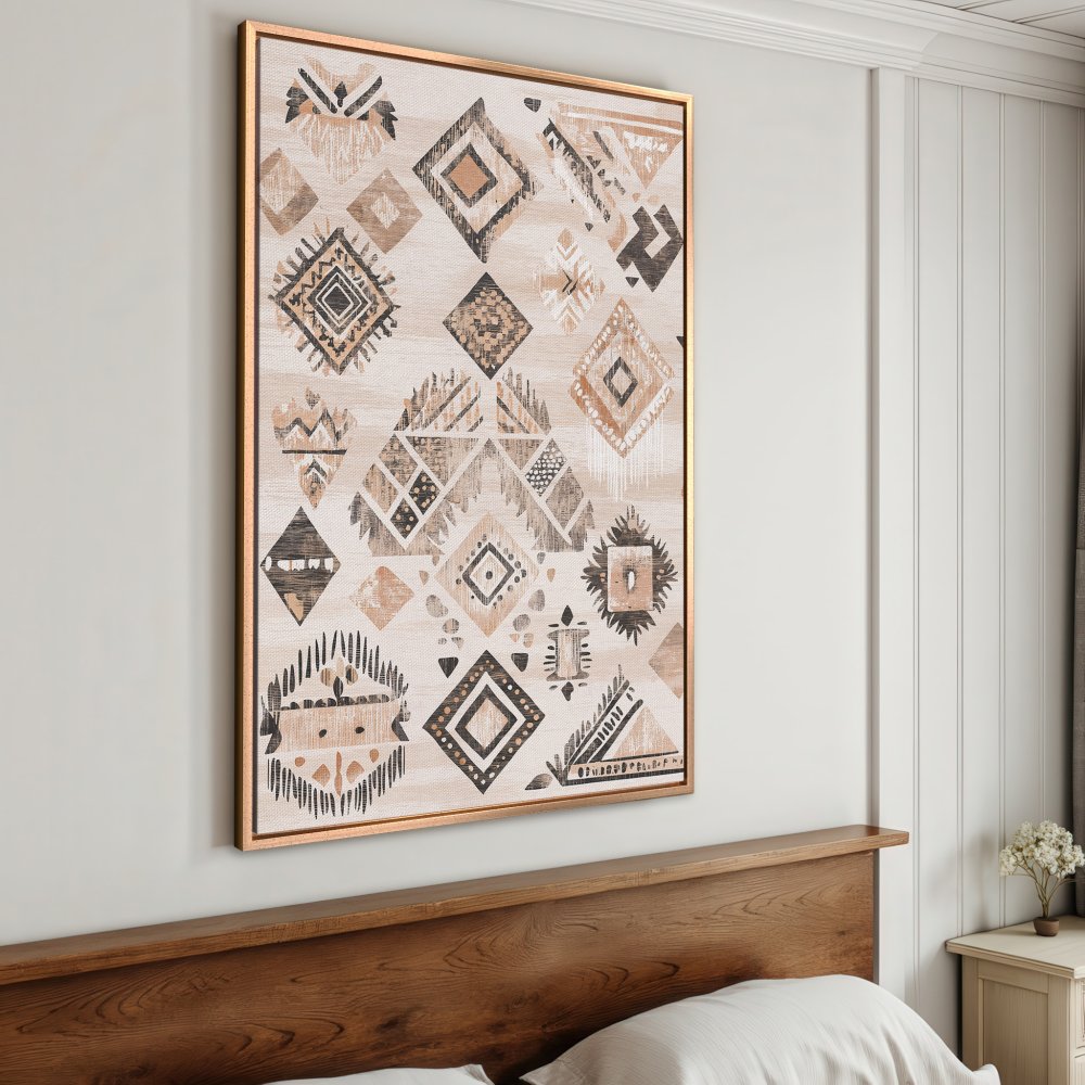 Framed Wall Art featuring a geometric tribal pattern in neutral beige, brown, and black tones. Perfect for adding a touch of boho style to your home.