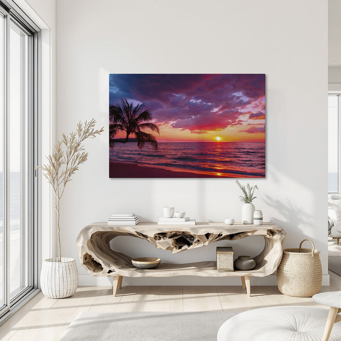 Framed Wall Art of a vibrant sunset over the ocean. Tropical scene with a palm tree, featuring a warm red, orange, and purple color palette. Perfect for home decor.