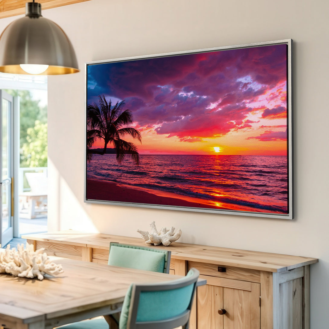 Framed Wall Art: Tropical sunset Canvas Print with vibrant red, orange, and purple hues. Coastal decor featuring palm trees and ocean view. Add warmth to your home!
