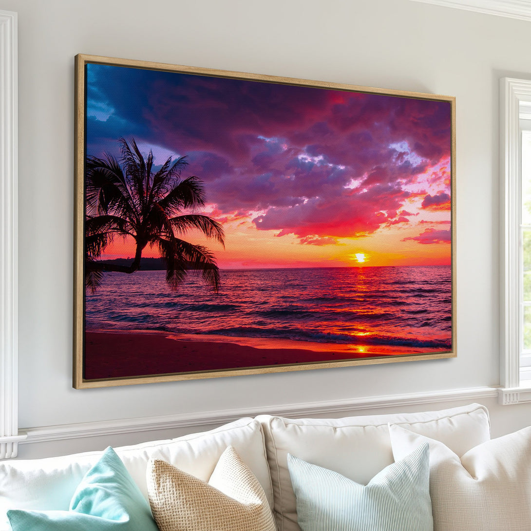 Framed Wall Art: Tropical sunset Canvas Print with vibrant red, orange, and purple hues. Palm tree silhouette against a dramatic sky, perfect for home decor.