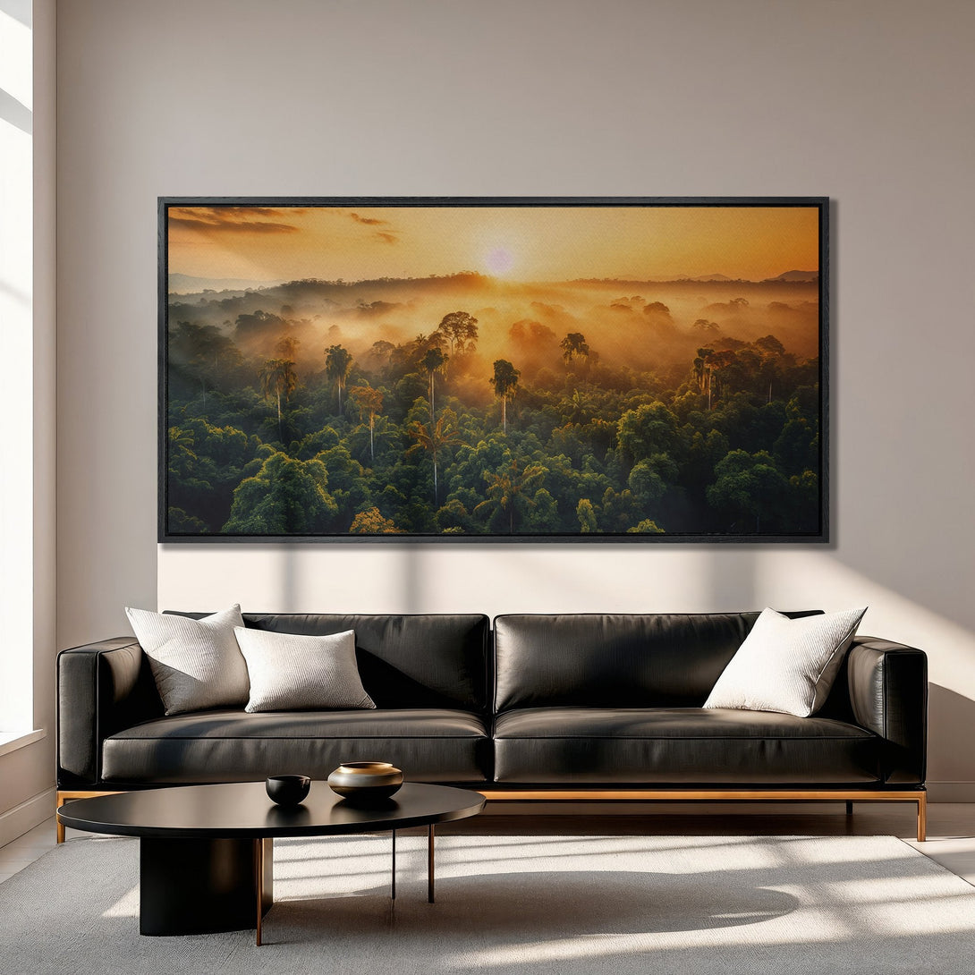 Framed Wall Art of a sunrise over a lush, green forest. Warm, golden hues dominate the sky, creating a serene and inviting atmosphere. Perfect for any home!