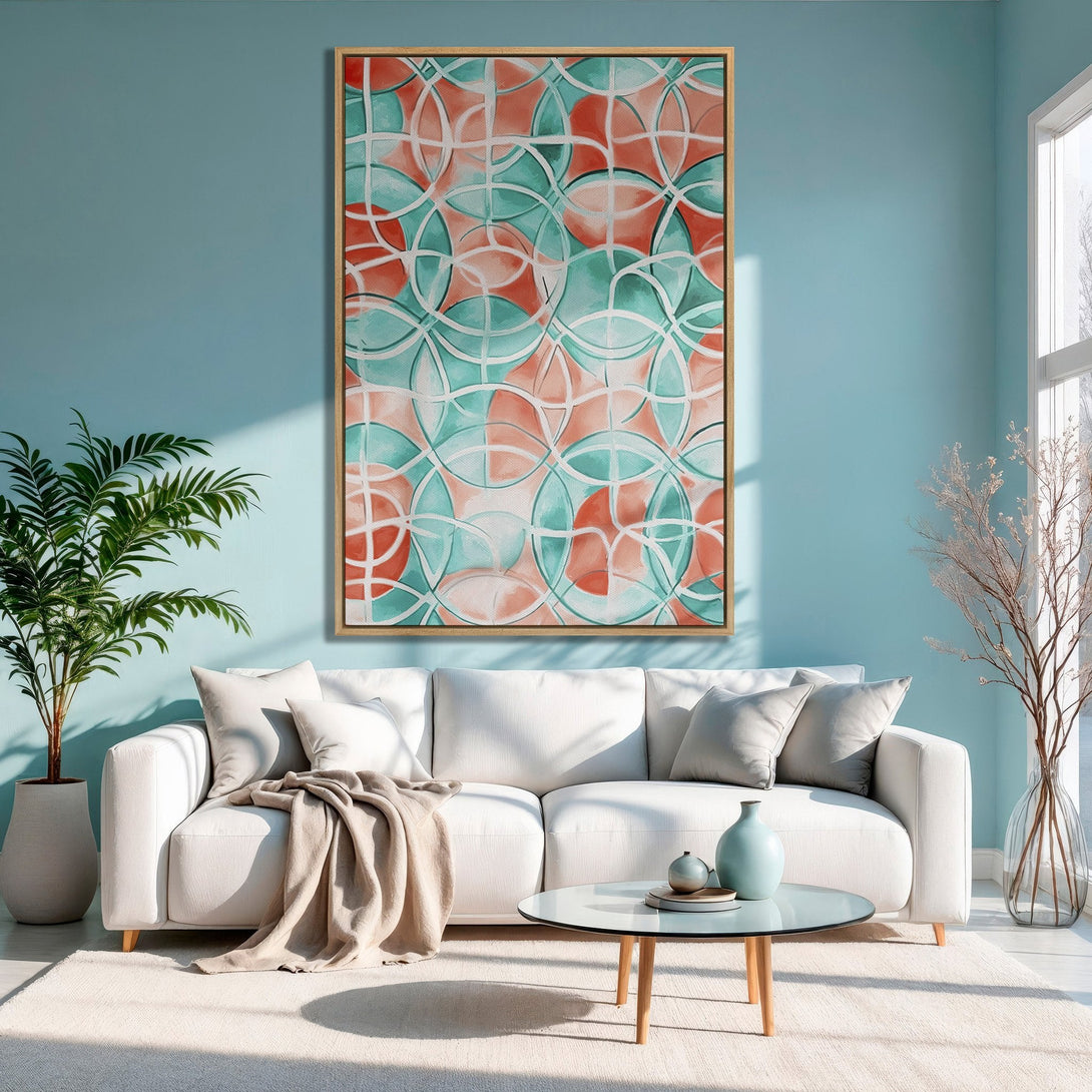 Framed Wall Art: Abstract geometric design in coral and teal. Modern Canvas Print adds a pop of color to a stylish living room with a light blue wall.