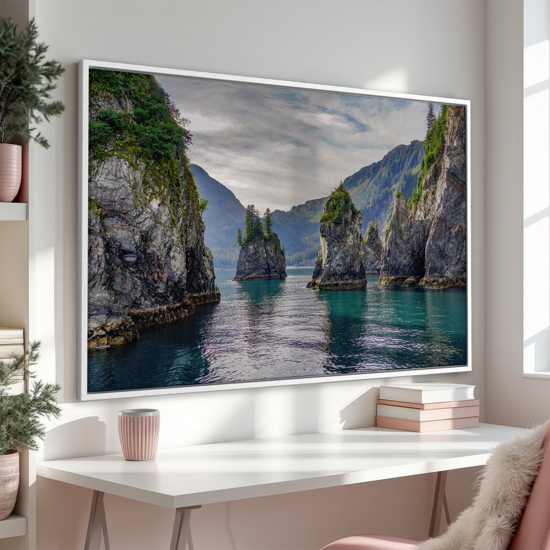 Framed Wall Art of stunning coastal landscape. Teal water, lush green cliffs, and moody sky. Bring nature's beauty into your home.