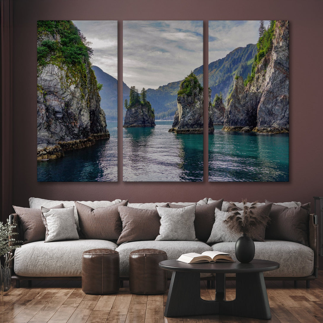 Canvas Print of stunning coastal landscape, featuring teal water, grey rocks, and green foliage. Modern art with a calming color palette.