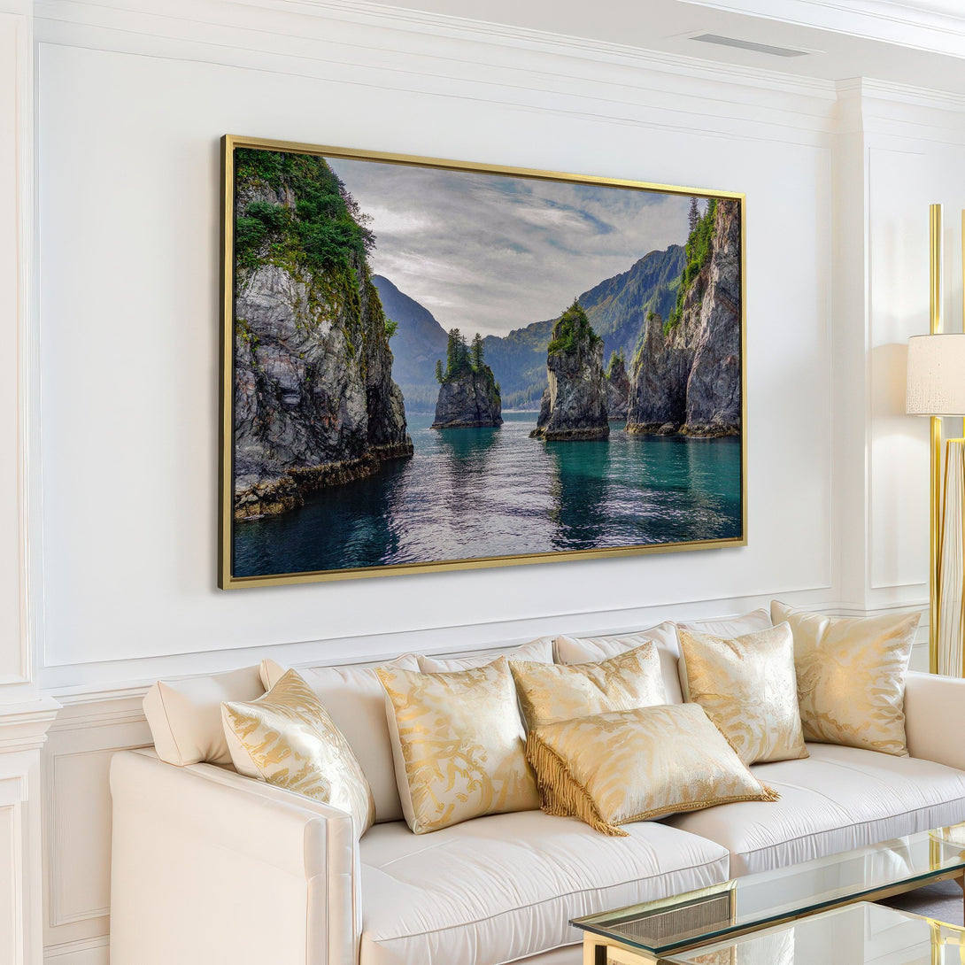 Canvas Print of a stunning coastal landscape. Featuring teal water, rocky cliffs, and lush green trees. A serene and calming addition to any home.