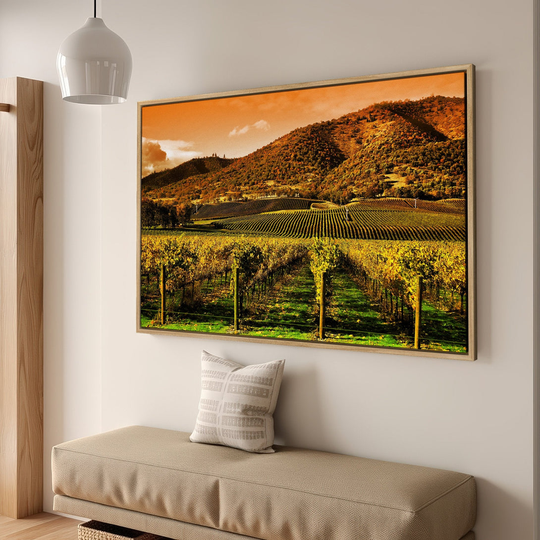 Framed Wall Art of a vineyard landscape in warm yellow and orange tones. Perfect for adding a touch of nature's beauty to your home.