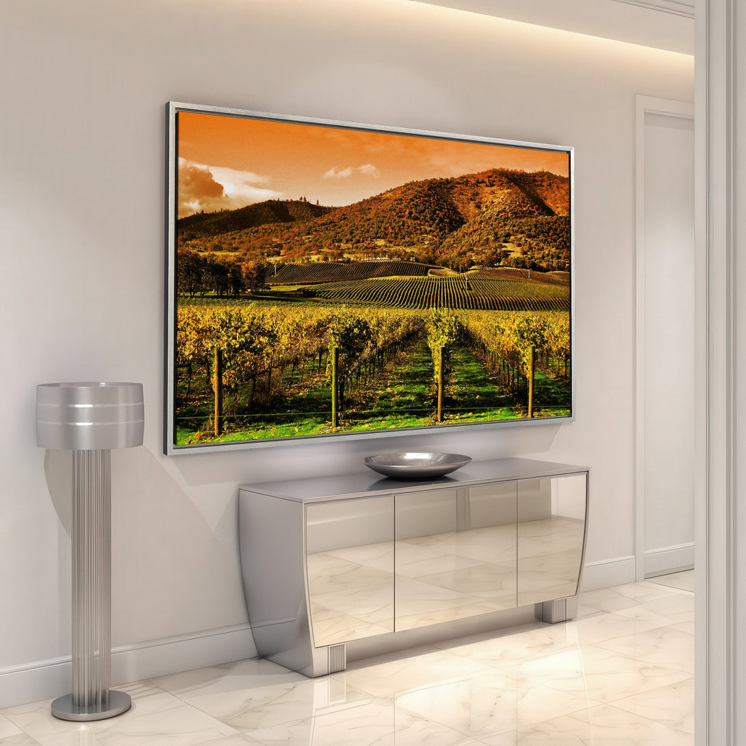 Framed Wall Art featuring a vineyard landscape in warm orange and yellow tones. Enhance your home with this stunning canvas print.