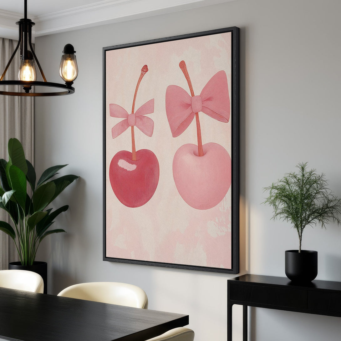 Framed Wall Art featuring two cherries with bows in a soft pink palette. Perfect for adding a touch of whimsy and style to your home decor!