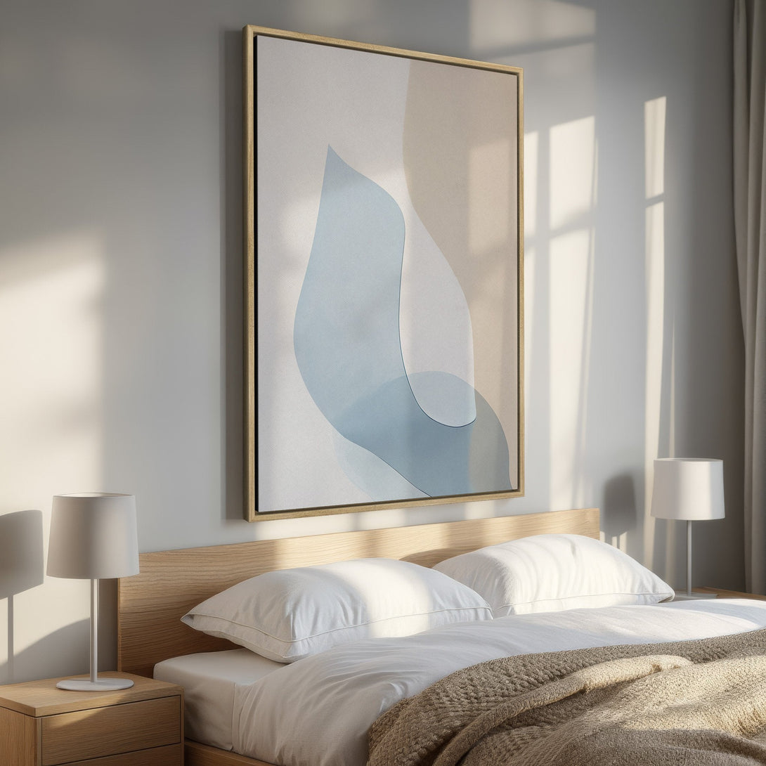 Framed Wall Art: Abstract blue and beige artwork in a bedroom. Modern style with a calming color palette. Perfect for adding a touch of elegance.