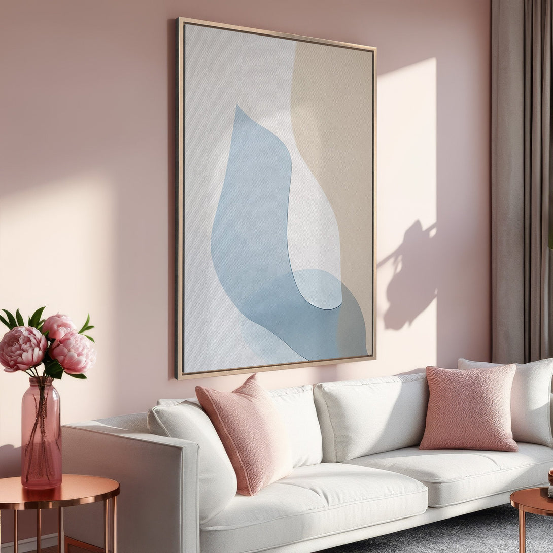 Framed Wall Art featuring an abstract blue and beige design, displayed in a modern living room with a blush pink color palette. Perfect for home decor!