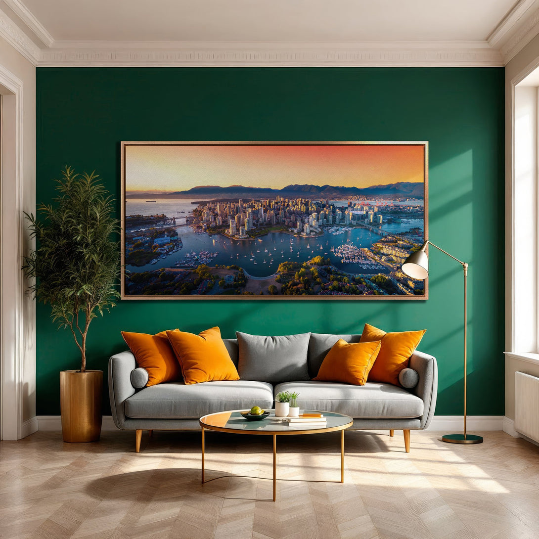 Framed Wall Art of a cityscape with warm sunset hues. Modern interior with green wall, grey sofa, and orange accents. Elevate your space!