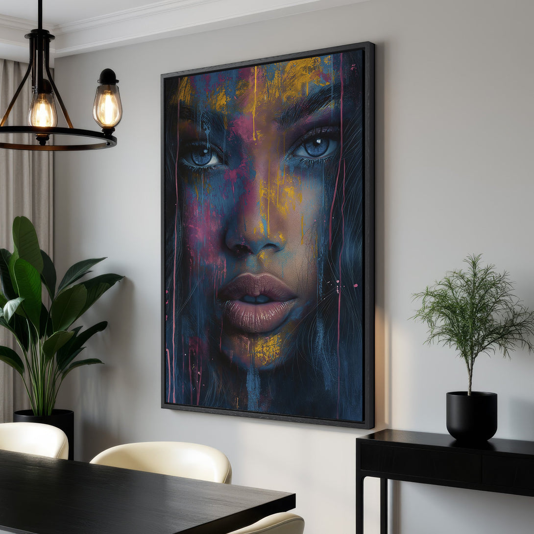 Framed Wall Art featuring a colorful abstract portrait. Modern style with a blue, pink, and gold color palette. Elevate your space with this stunning Canvas Print!