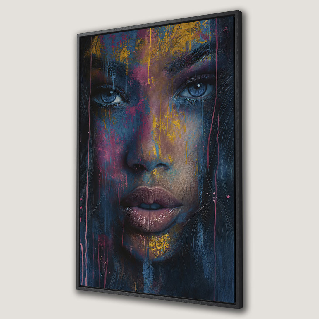 Framed Wall Art: Abstract portrait canvas print of a woman's face. Features blue eyes, pink & gold paint strokes on a dark blue backdrop. Modern art for your home.