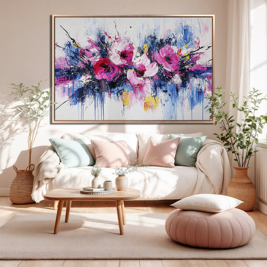 Framed Wall Art: Abstract floral painting in pink, blue, and yellow. Modern style canvas print adds a pop of color to any living room.