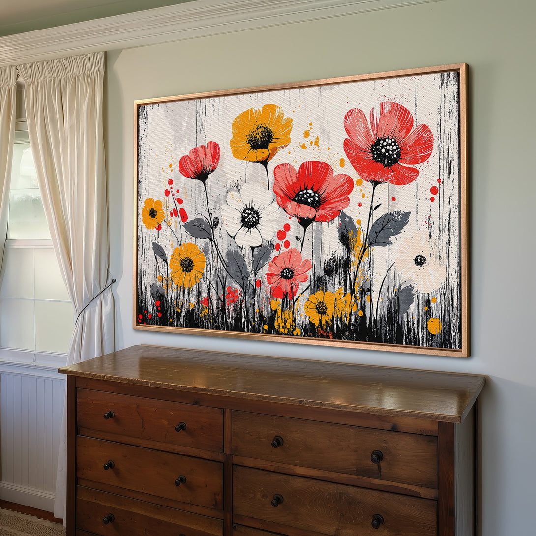 Framed Wall Art featuring vibrant red & yellow floral design. Modern abstract style, perfect for adding a pop of color to any room.
