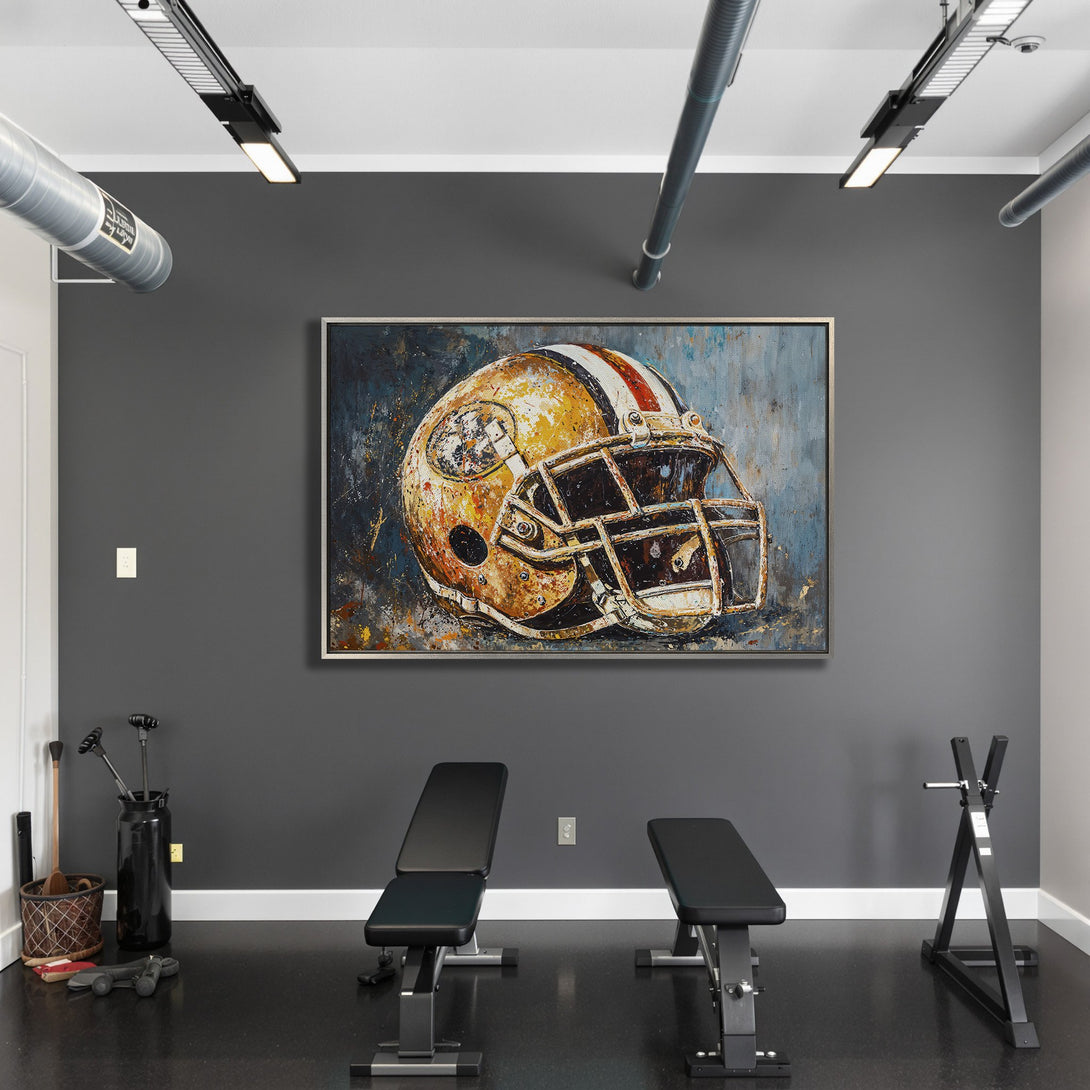 Framed Wall Art: Abstract football helmet painting in a modern gym. Features a gold, blue, and red color palette. Elevate your space with unique art!