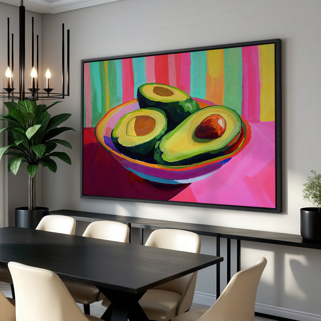 Framed Wall Art: Vibrant avocado painting in a modern style with a colorful, pink, green, and yellow palette. Perfect for kitchen or dining room decor.