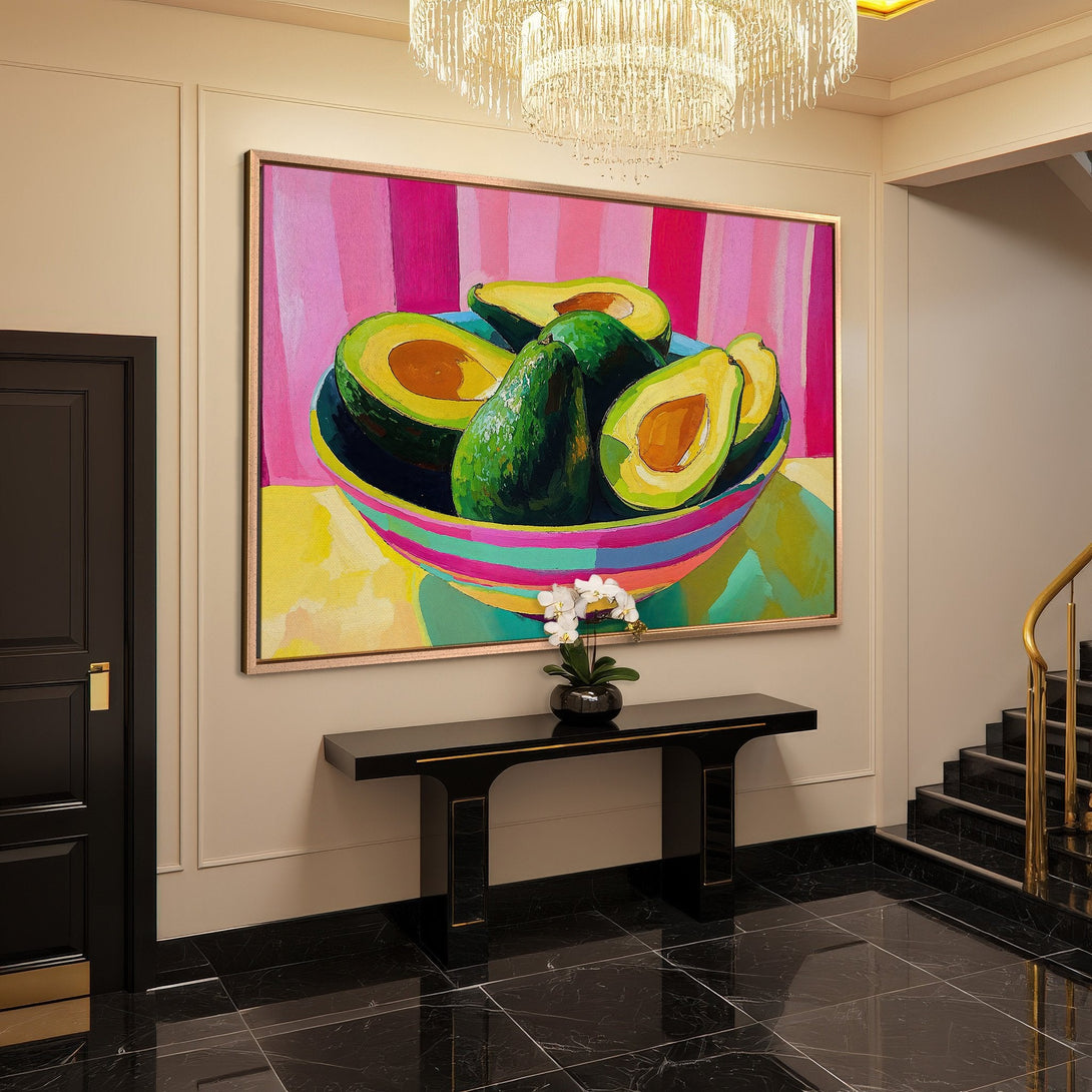 Framed Wall Art featuring a vibrant avocado still life painting. Bold, colorful art with a pink, green, and yellow palette, perfect for modern decor.