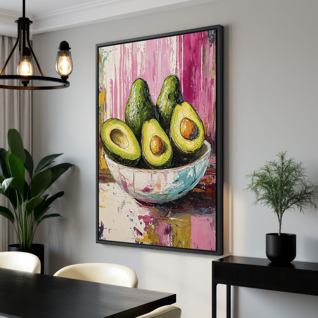 Framed Wall Art: Vibrant avocado painting in a modern style with a pink, green, and yellow color palette. Perfect for kitchen or dining room decor.