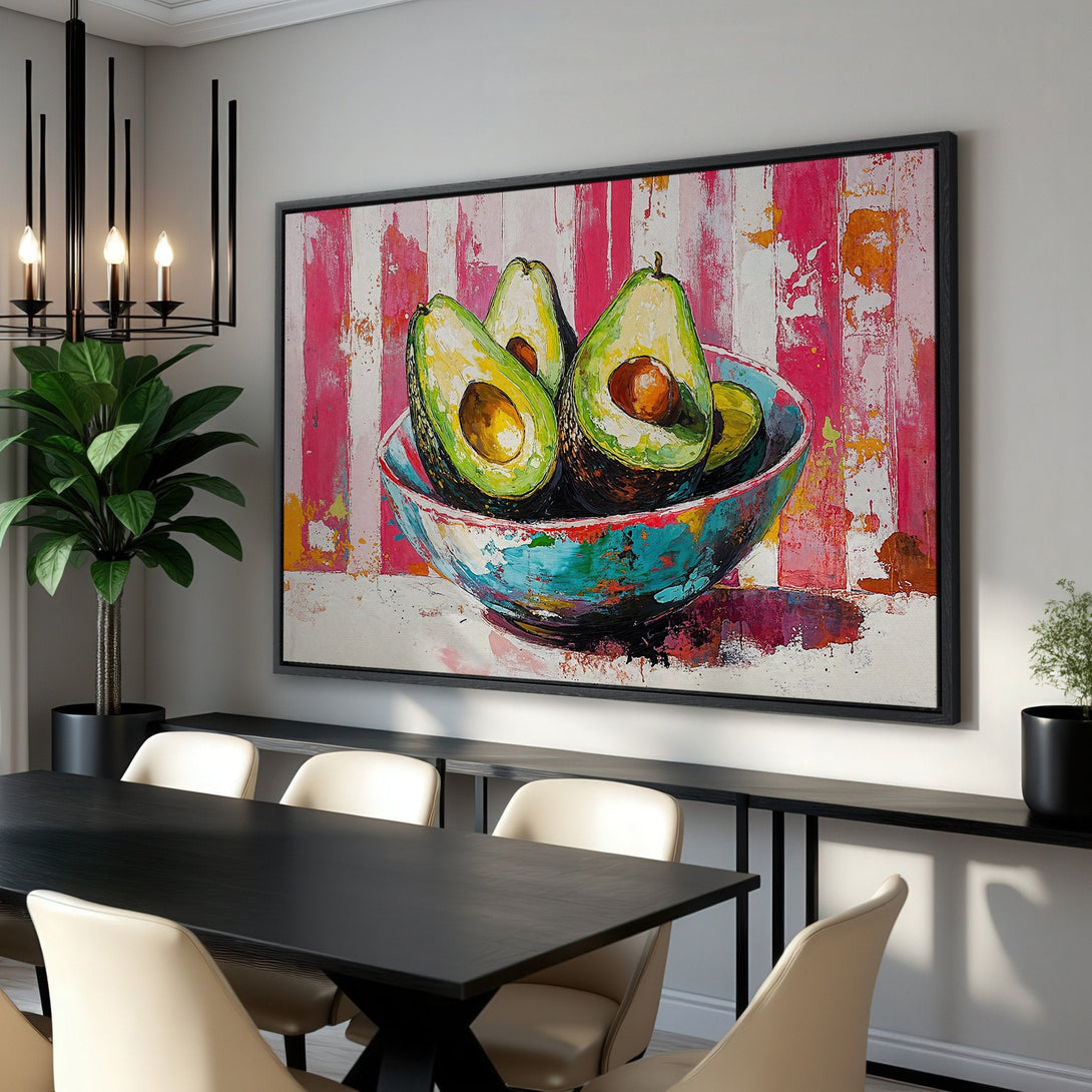 Framed Wall Art: Vibrant avocado still life canvas print in a modern dining room. Pop art style with bright pink, green, and teal color palette.