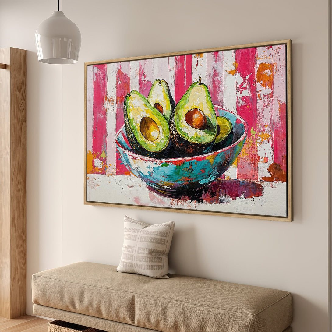 Framed Wall Art: Vibrant avocado painting with a modern, abstract style. Features a colorful palette of pink, green, and teal. Perfect kitchen or dining room decor.