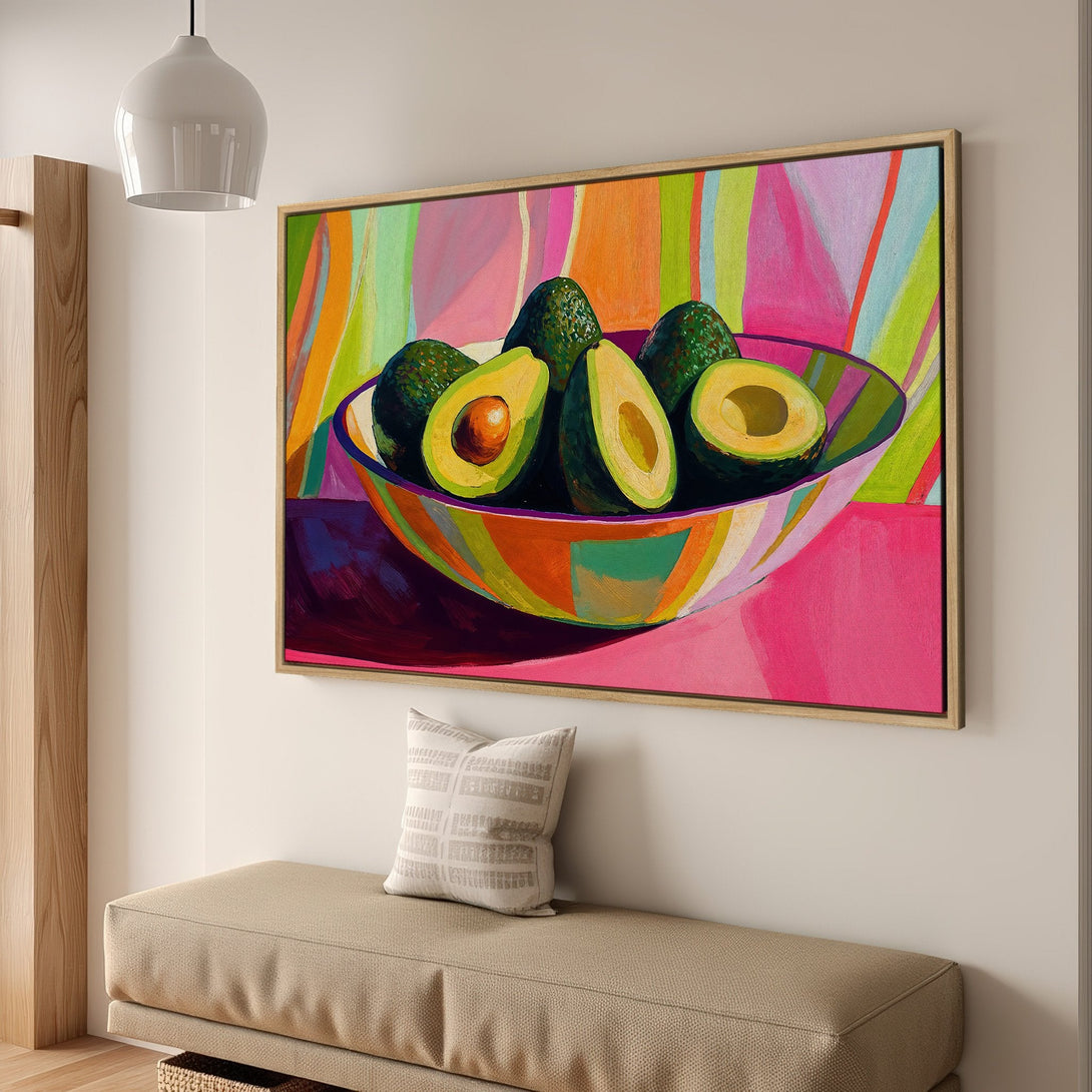 Framed Wall Art: Vibrant avocado painting in a pop art style with a pink, green, and orange color palette. Perfect kitchen or dining room decor.